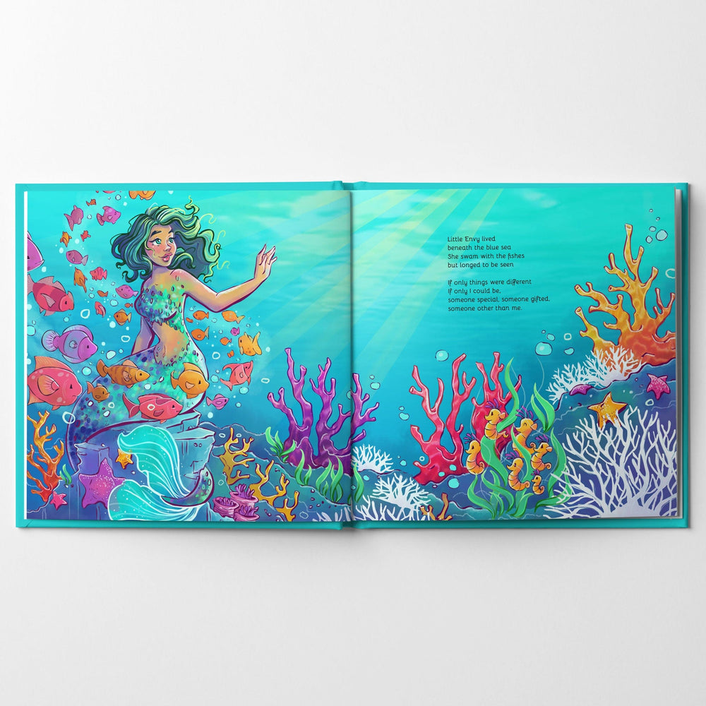 Inside spread from children's book Little Envy of a mermaid sitting on a rock