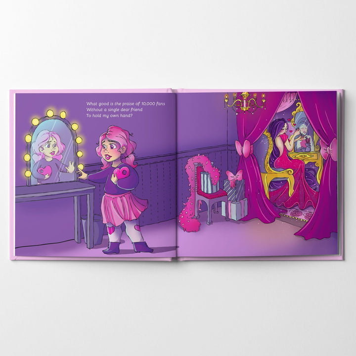 Inside spread of children's book Little Love with a girl holding a heart with a hole in it