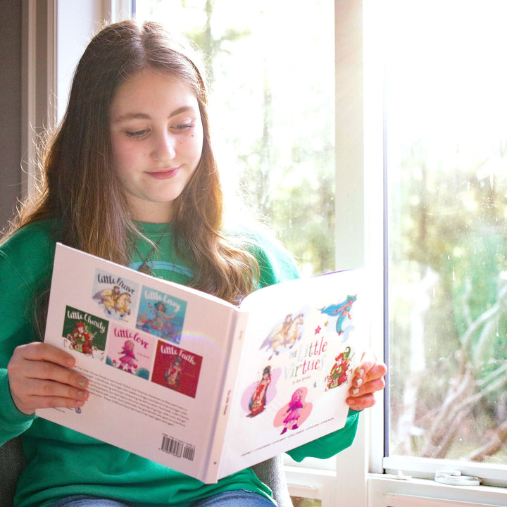 Young girl reading The Little Virtues Compilation Volume One